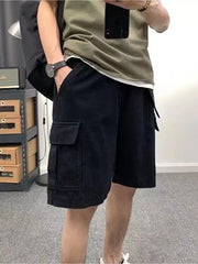 Men's black cotton cargo shorts with multiple pockets.