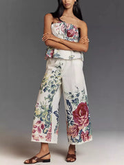 Chic floral ruched strapless top and wide-leg pants set in polyester.
