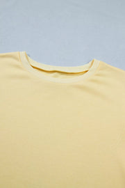 Yellow cotton half-sleeve top with crew neck detail
