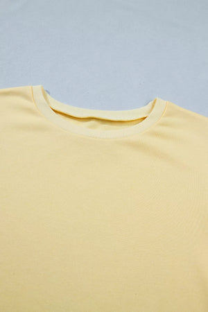 Yellow cotton half-sleeve top with crew neck detail