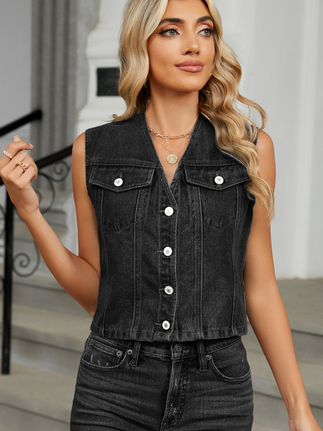 Black denim cropped utility vest with button front and chest pockets