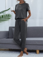 Charcoal relaxed-fit tee and jogger set with drawstring waist and pockets.