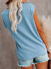 Light blue relaxed tee with cap sleeves and a pocket detail, worn with denim shorts.