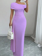 Purple asymmetrical ruched maxi dress with off-shoulder neckline and body-hugging fit.