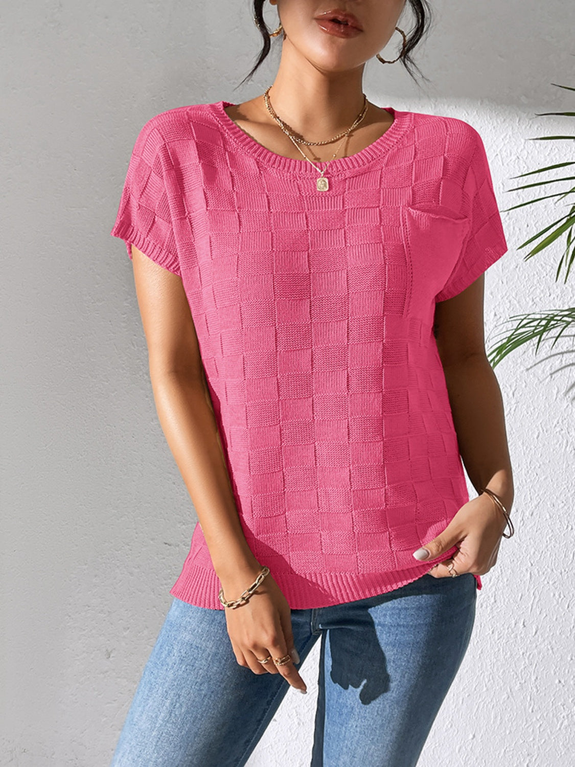 Textured knit pocket tee in bright pink with a checkerboard pattern and crew neck.