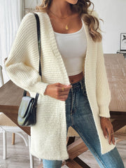 Cream ribbed knit dolman sleeve cardigan with open front and relaxed fit.