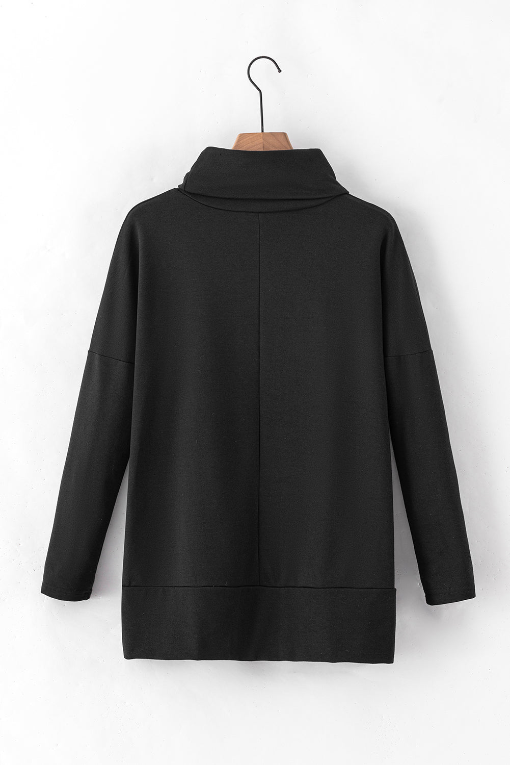 Black tunic with cowl neckline and long sleeves, featuring a drape-front detail.