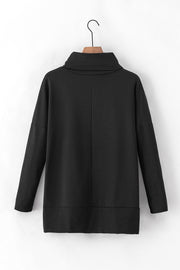 Black tunic with cowl neckline and long sleeves, featuring a drape-front detail.