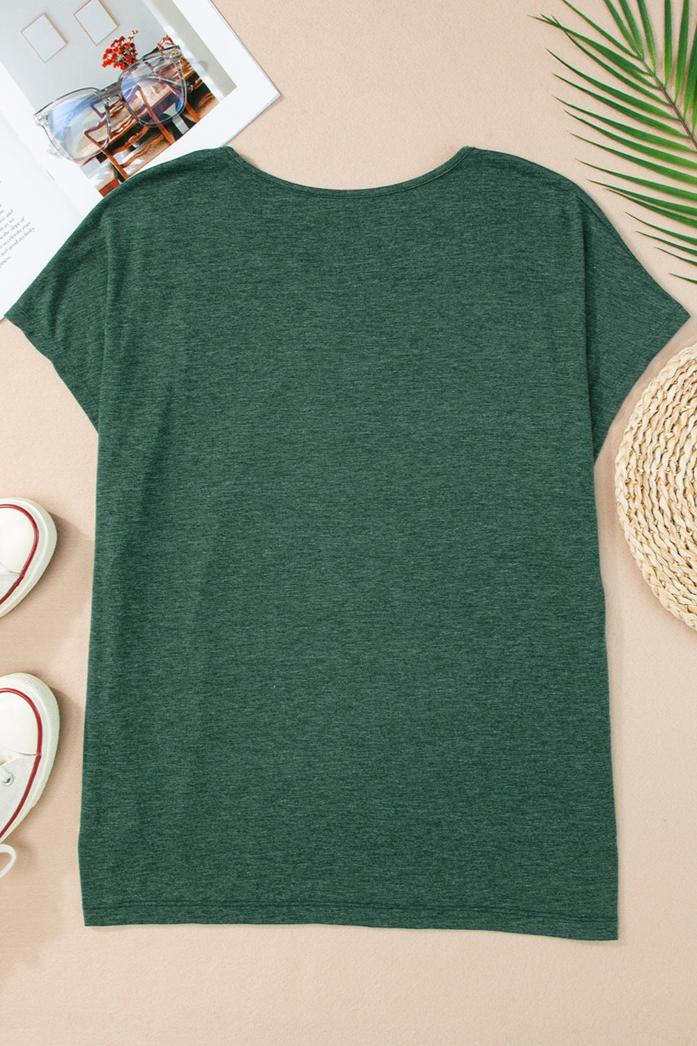 Dark green dolman sleeve tunic tee with a rounded neckline.
