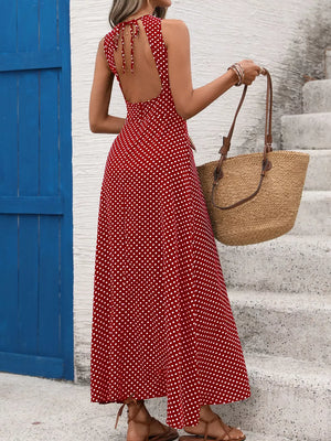 Deep red polka dot maxi dress with open back and tie detail.