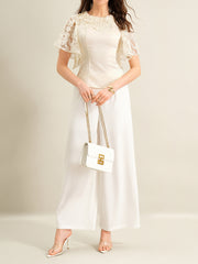 Apricot lace trimmed short-sleeve blouse with elegant lace neckline and flutter sleeves.