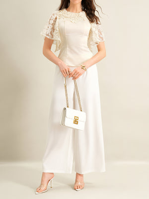 Apricot lace trimmed short-sleeve blouse with elegant lace neckline and flutter sleeves.