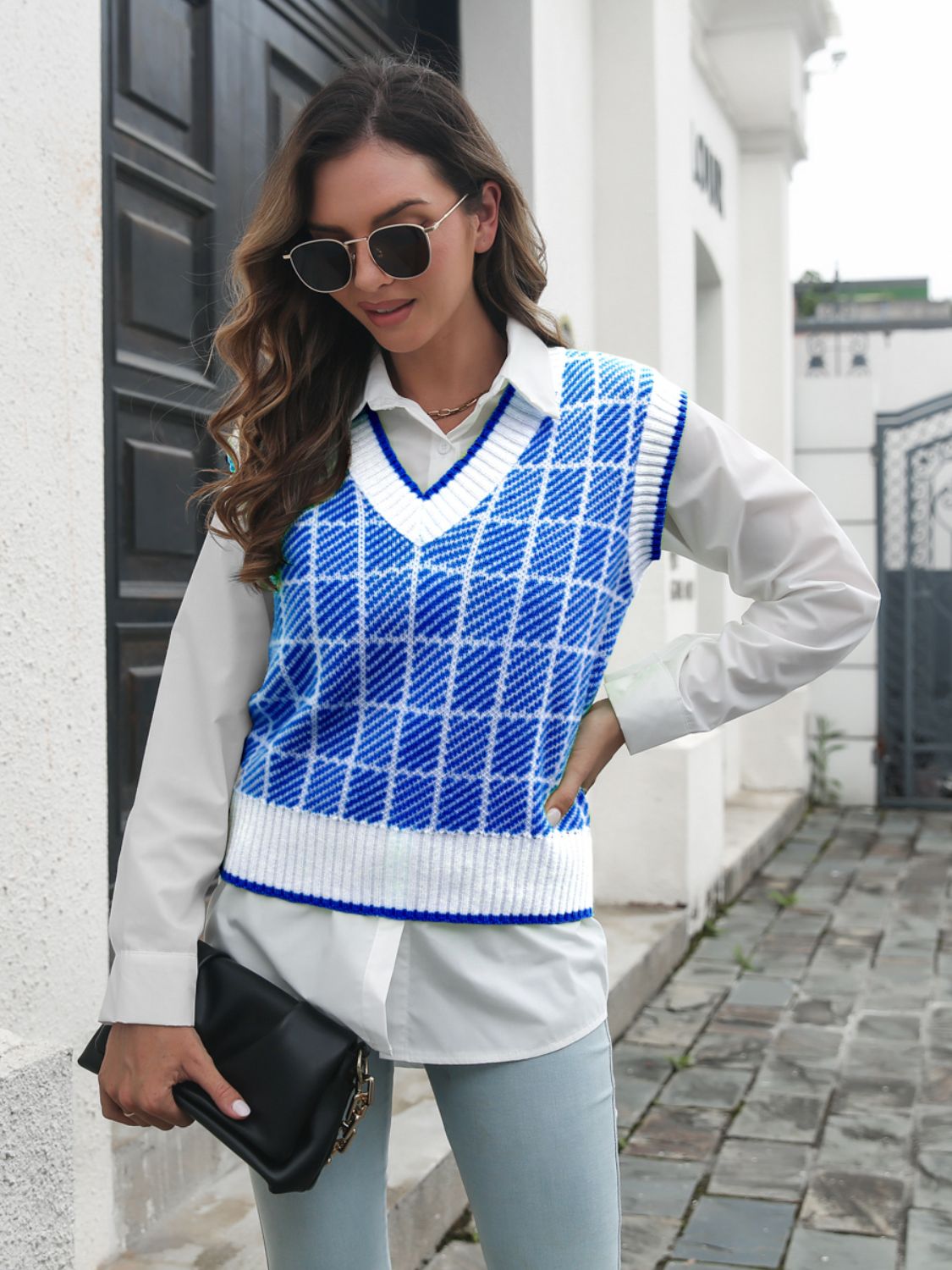 Plaid V-neck vest in Peacock Blue and white acrylic, with ribbed trim.