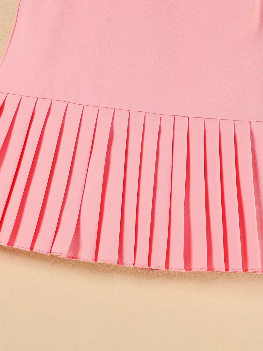 Pink toddler dress with pleated hem detail