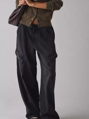 Black drawstring waist cargo jeans with utility pockets and a relaxed fit.
