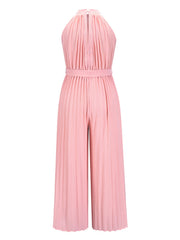 Blush pink pleated palazzo jumpsuit with halter neckline and belted waist.