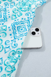 Patchwork mini dress in blue and white ikat print with a hidden pocket detail.