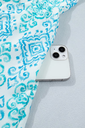 Patchwork mini dress in blue and white ikat print with a hidden pocket detail.