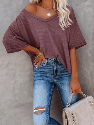 Maroon waffle knit relaxed v-neck t-shirt with short sleeves.