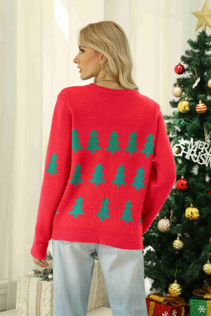 Red crewneck sweater with emerald tree motif pattern and long sleeves.