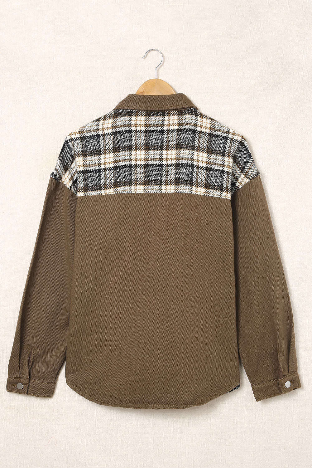 Olive shacket with plaid yoke and collared neckline.