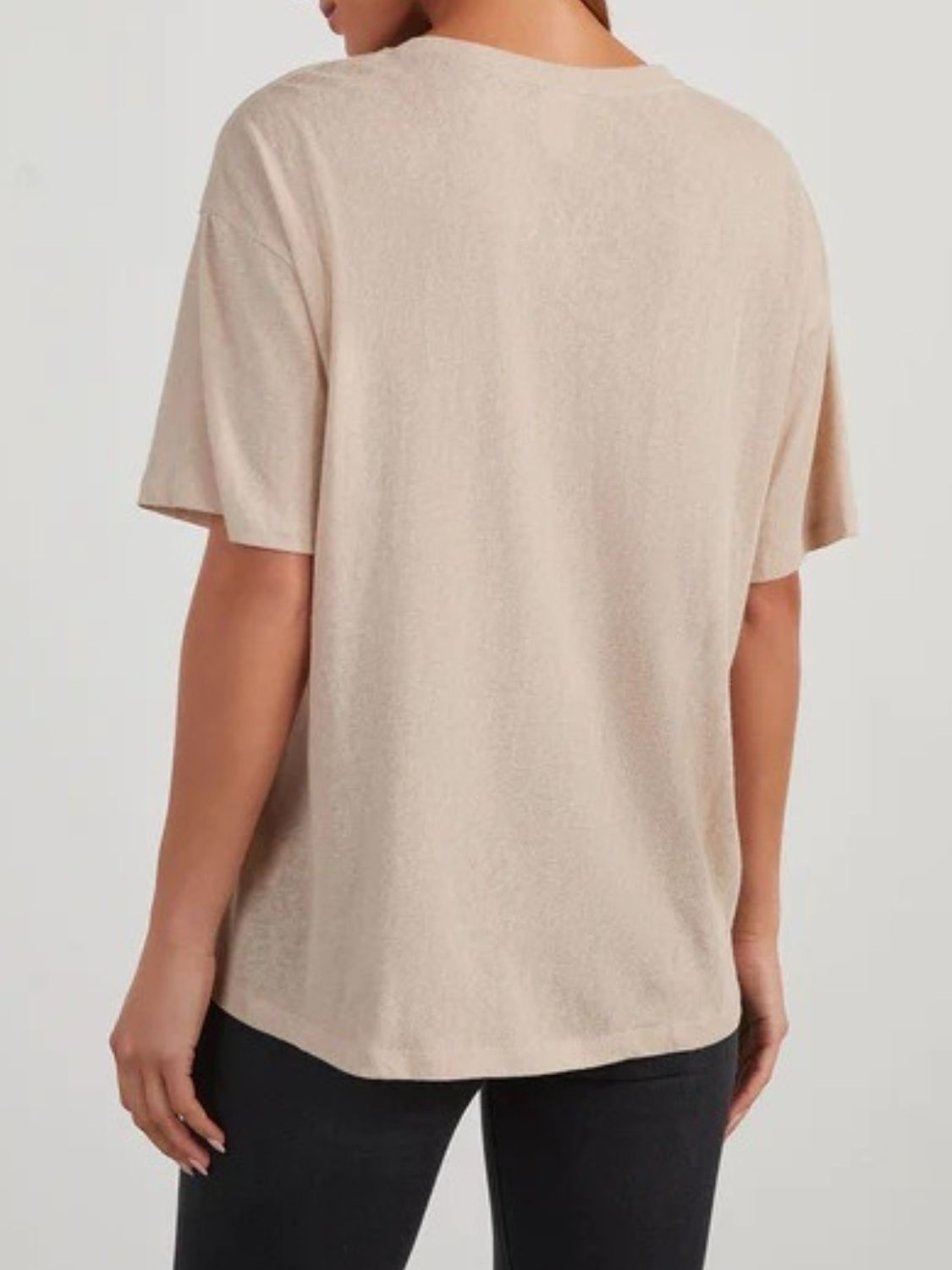 Tan linen boxy tee with short sleeves and a patch pocket, shown from the back.