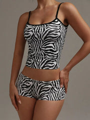 Women's zebra print pajama set with cami top and shorts.