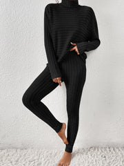 Black ribbed turtleneck lounge set with long sleeves and leggings.