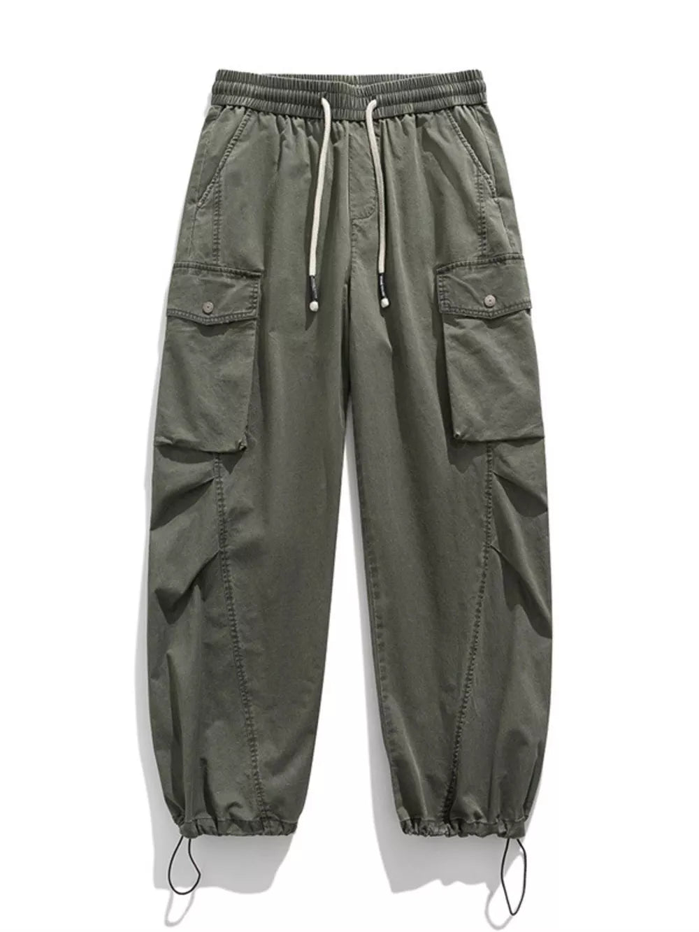 Green cargo pants with drawstring waist, button-down flap pockets, and adjustable cuffs.
