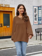 Caramel balloon sleeve crewneck knit sweater with ribbed cuffs and hem.