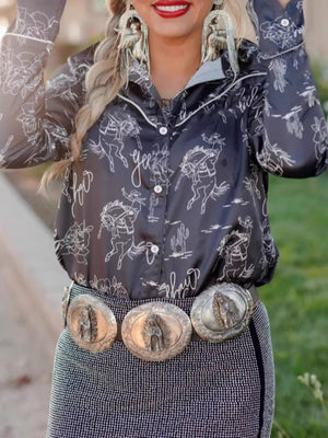 Black long sleeve button up maternity shirt with rodeo print and white piping