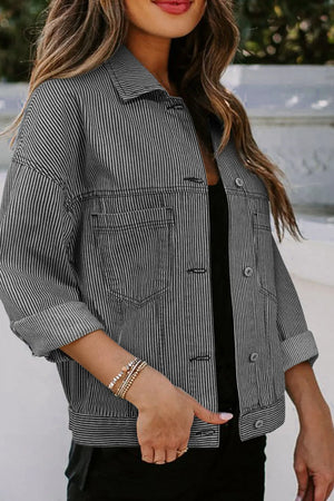 Pinstripe denim trucker jacket in dark with button front and chest pockets.