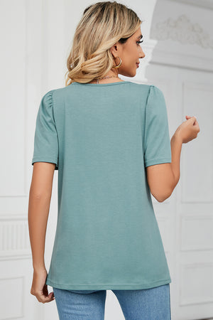 Light green tee with square neck and sculpted short sleeves.