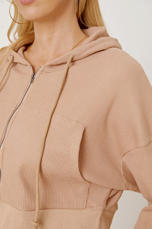 Waffle knit cropped zip hoodie in khaki with a front pocket and drawstring hood.