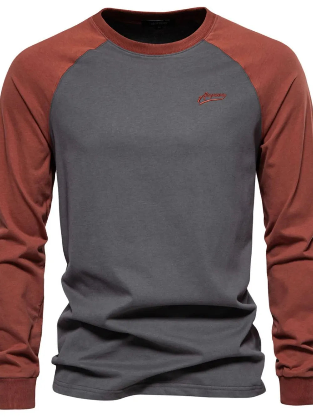 Colorblock raglan tee in gray with rust sleeves and embroidered logo detail.