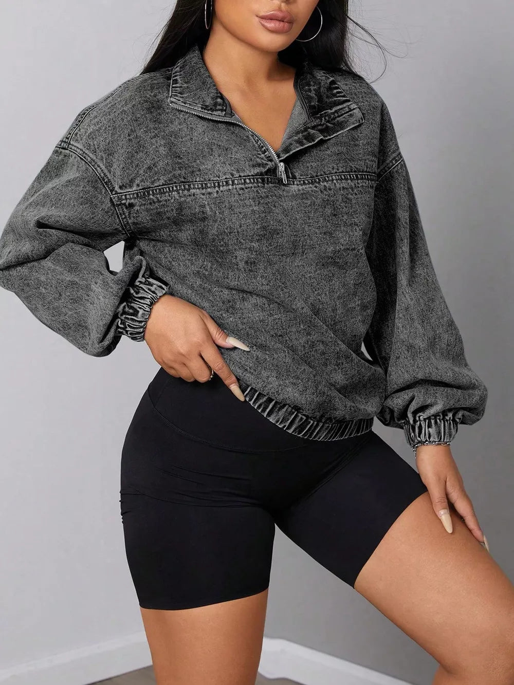 Dark gray acid wash denim quarter-zip sweatshirt with elastic hem and cuffs.