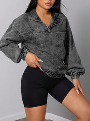 Dark gray acid wash denim quarter-zip sweatshirt with elastic hem and cuffs.