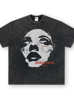 Dark gray oversized graphic tee with a distressed wash and a large black and white face print.