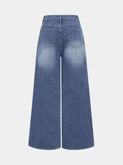 Chic high-waisted wide-leg jeans in blue denim with a faded wash and button closure.