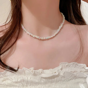 Pastel petal chain necklace with pink and purple beads, delicate and chic.