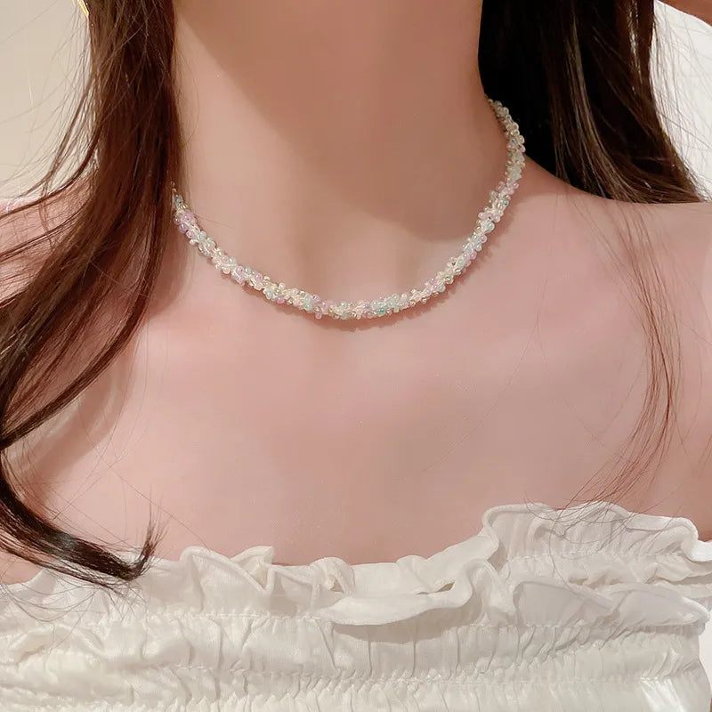 Pastel petal chain necklace with pink and purple beads, delicate and chic.