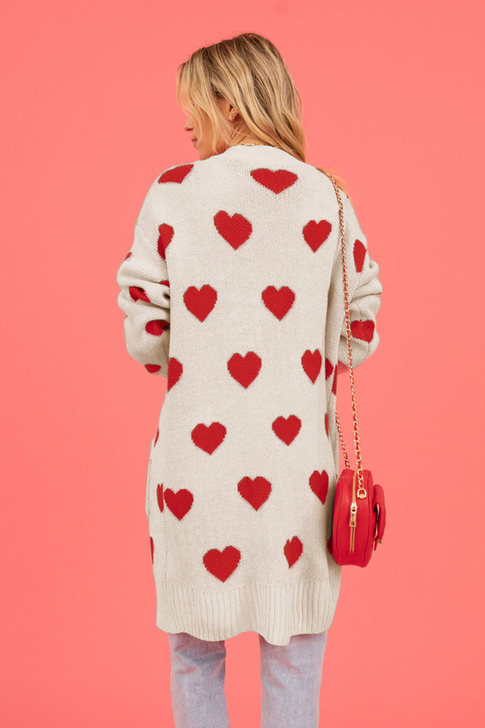 Cream longline knit cardigan with red heart motif, acrylic, long sleeves.