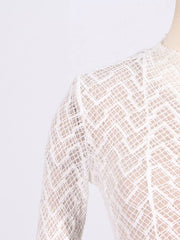 White lace maxi dress with mock neck and geometric pattern detail