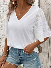 White v-neck tee with flared lace inset sleeves and raw hem detail.
