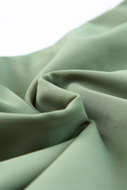Sage ruched bodice halter swim dress fabric detail