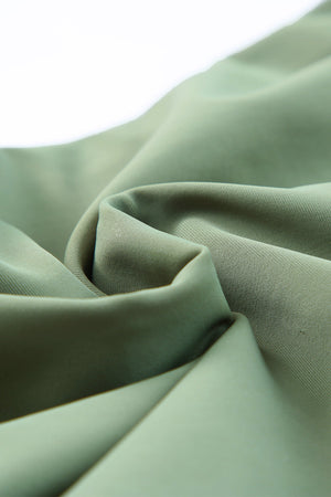 Sage ruched bodice halter swim dress fabric detail