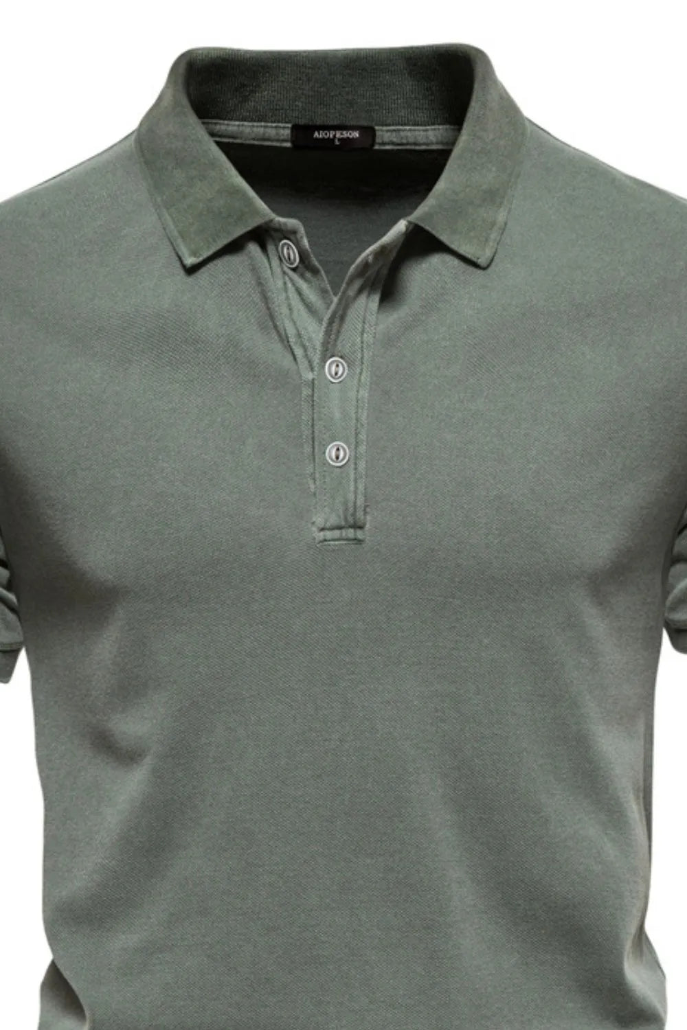 Sage green textured polo shirt with buttoned placket and spread collar.