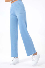 Light wash denim utility pocket straight leg jeans with elastic waistband.