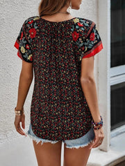Bohemian floral print blouse with flutter sleeves and a split neckline in multicolor.
