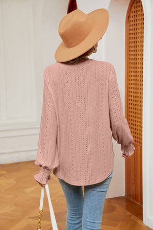Blush pink eyelet detail poet sleeve blouse with ruffled cuffs.